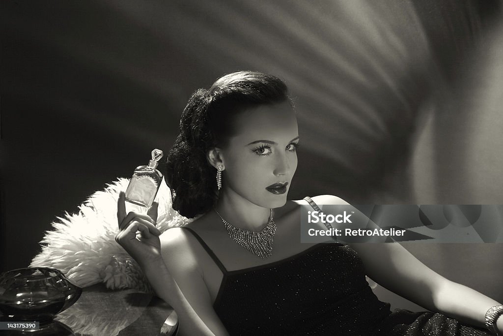 Noir Style.New fragrance Emulation of classic noirold hollywood style.Filters,grain and noise added for more effect. Perfume Stock Photo