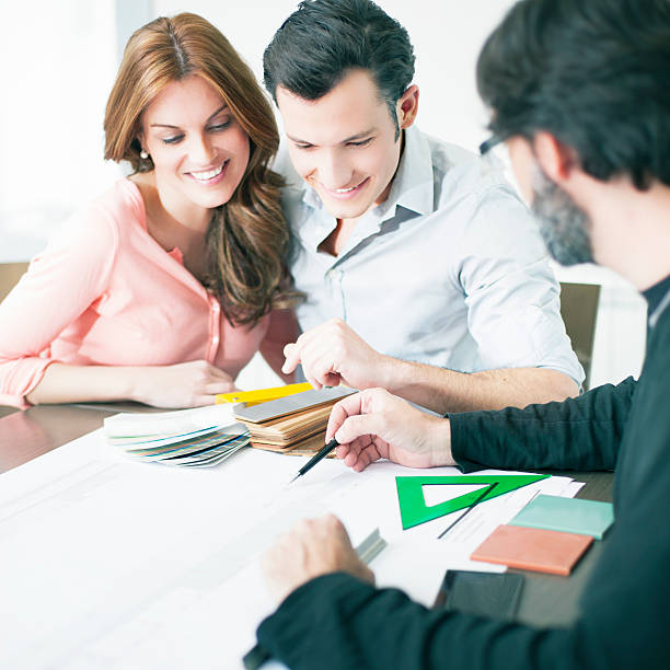 istock Young couple in a meeting with the architect 143175397