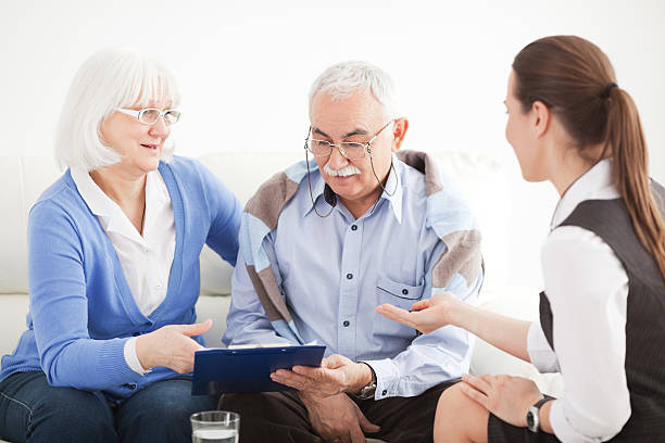 istock Senior couple with consultant. 143175715