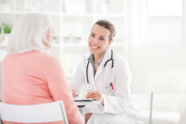 istock Senior woman with doctor. 143175744