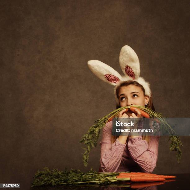 Bunny Girl With Carrot Mustache Stock Photo - Download Image Now - Carrot, Holding, Humor