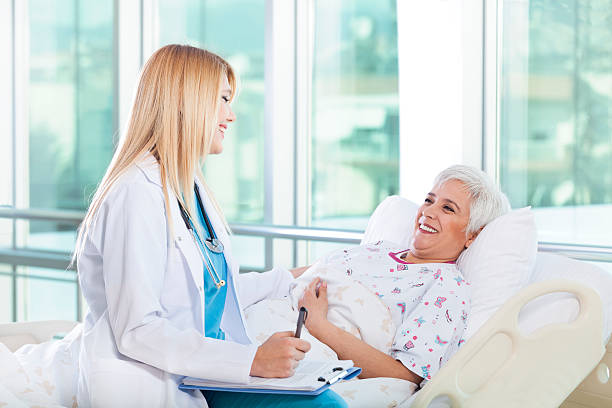 istock Female doctor talking with senior patient 143176203