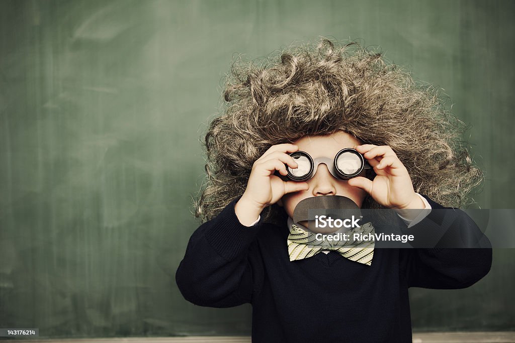 Little Genius A young smarty pants sees the world in a unique way. What is your approach to problems? Child Stock Photo