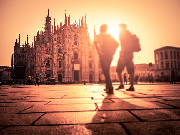 People walking in Piazza Duomo at sunset, Milan, Italy.Tilt & Shift effect: focus on the top of the cathedral. The photo has been taken during iStockalypse 2011 in Milan.