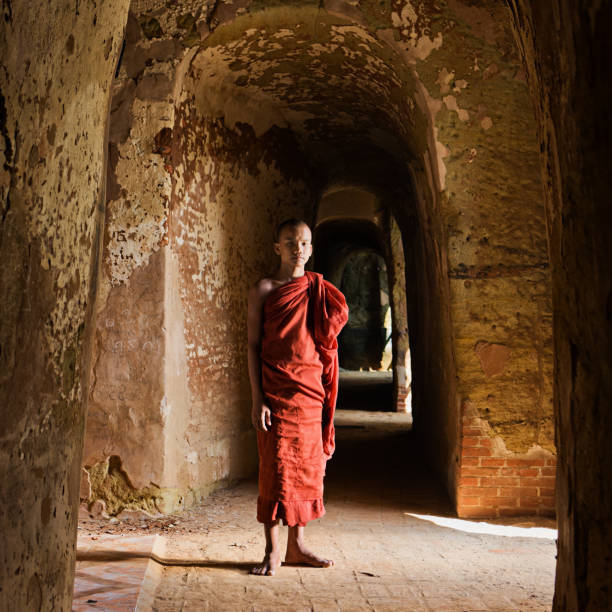 istock Novice Buddhist monk inside the temple 143176397