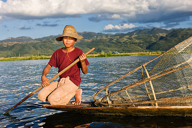 istock Young fisherman on Inle Lake, Myanmar 143176406