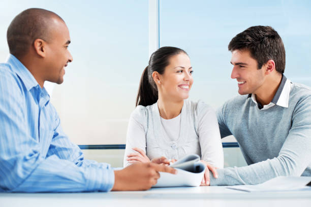 istock Couple meeting with financial advisor. 143176492