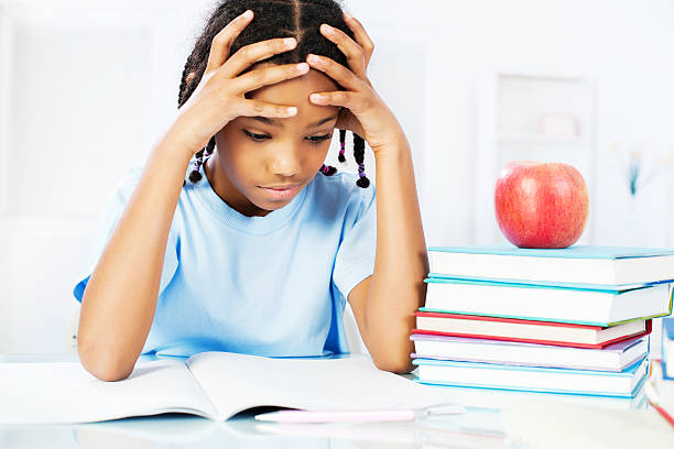 istock African American girl learning at the home 143176636