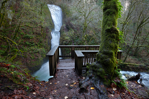 A view of Bridal Veil Falls with the observation deck in the foreground.