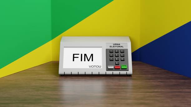 istock 3d rendering, electronic voting machine with Brazilian flag colors in the background, written end voted on the screen in portuguese and written: 