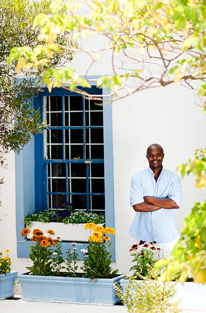istock Black male in front of home 143176782