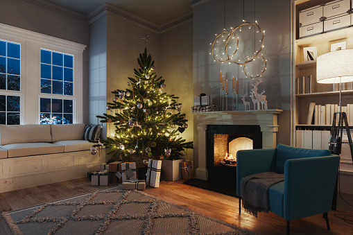 Fireplace, Christmas tree and presents in a cozy house with snowy mountain view.