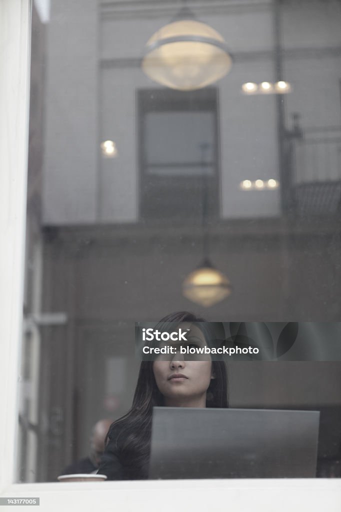 Woman Using an Ultrabook in a Coffee Shop  Adult Stock Photo