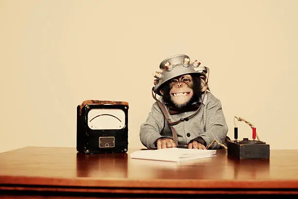 Photo of Young Chimpanzee Nerd with Mind Reading Helmet