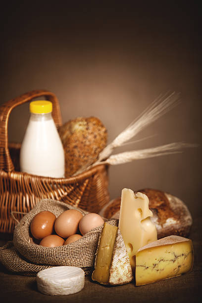 istock Dairy products, bread and eggs on linen canvas. 143177272