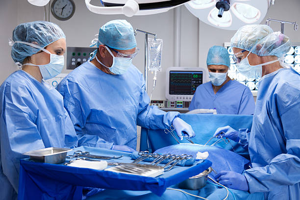 Surgical Team  gchutka stock pictures, royalty-free photos & images