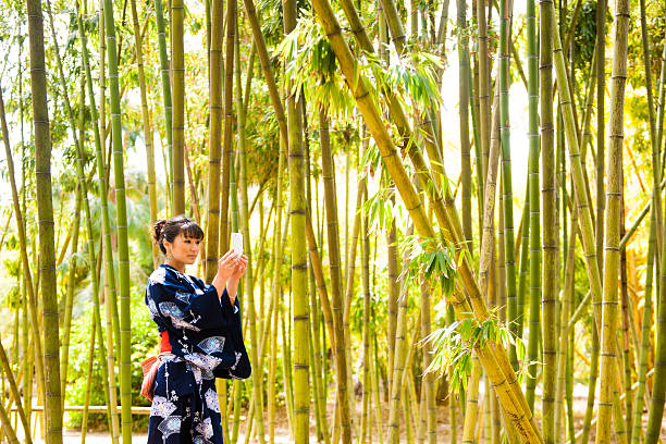 istock Asian Woman in Bamboo Texting 143177411