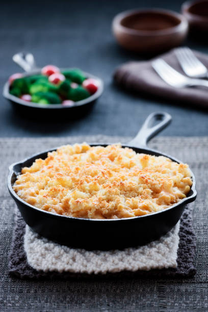 Baked Macaroni and Cheese  cooked selective focus vertical pasta stock pictures, royalty-free photos & images