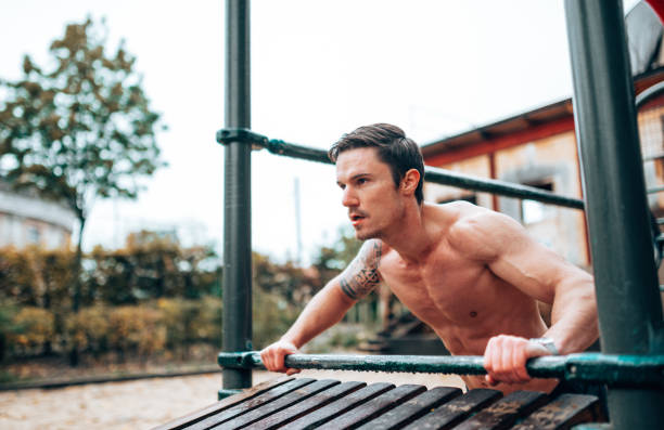 istock man doing calisthenics at the park 1431777900