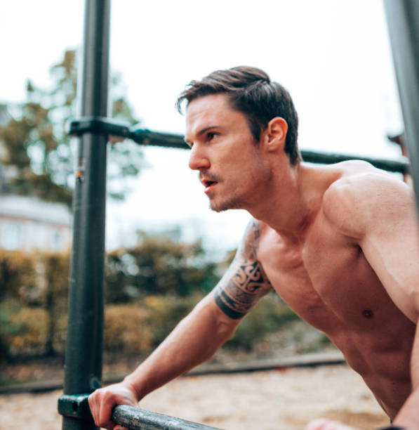 istock man doing calisthenics at the park 1431778248
