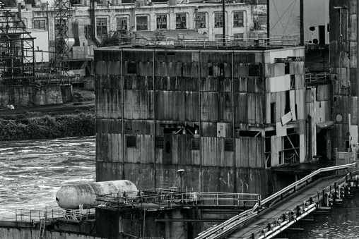 Long abandoned paper mill in Portland OR. Black and white photo.