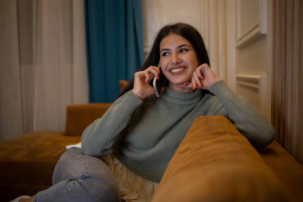 istock Happy young woman using phone 1431786055