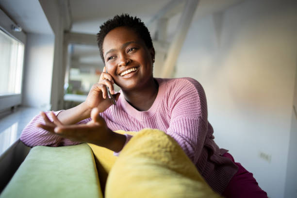 istock Happy young woman using phone 1431789094