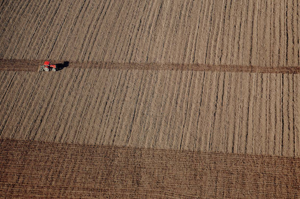 istock tractor working in the farm 1431791759