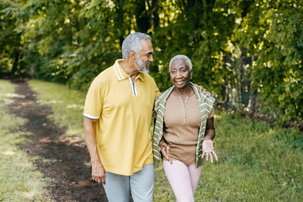 istock Seniors walking in the park 1431797810
