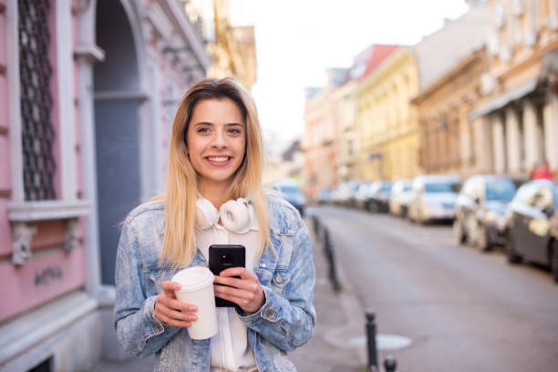 istock Happy young woman using phone 1431798606