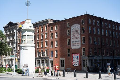 New York, NY, USA - June 4, 2022: The Titanic Memorial Lighthouse at the entrance to the South Street Seaport Historic District.