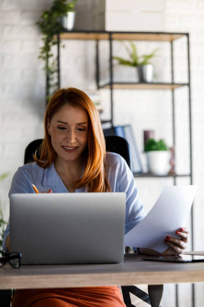 istock Woman working on laptop at home office 1431799881