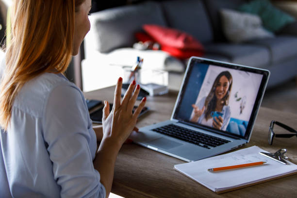 istock Young woman gesturing while video chatting with a friend 1431799886