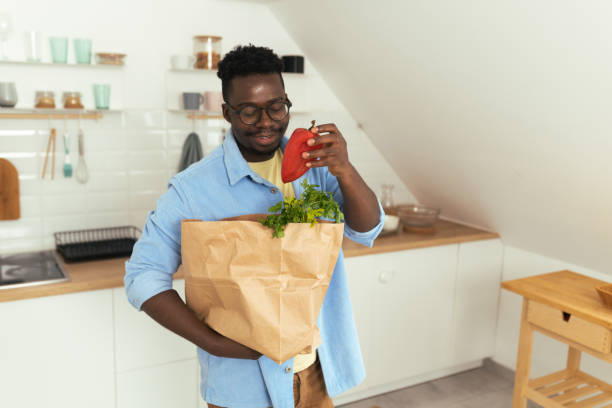 istock Man hold eco shopping bag with fresh vegetables 1431801991