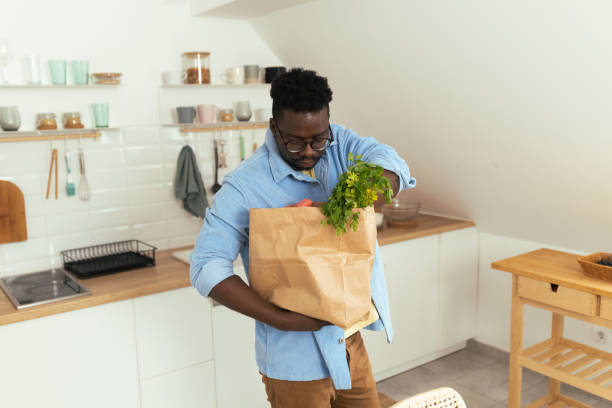 istock Man hold eco shopping bag with fresh vegetables 1431801992