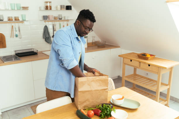 istock Man hold eco shopping bag with fresh vegetables 1431802005