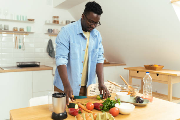 istock Man prepares a vegetarian meal 1431802010