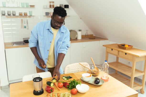 istock Man prepares a vegetarian meal 1431802019