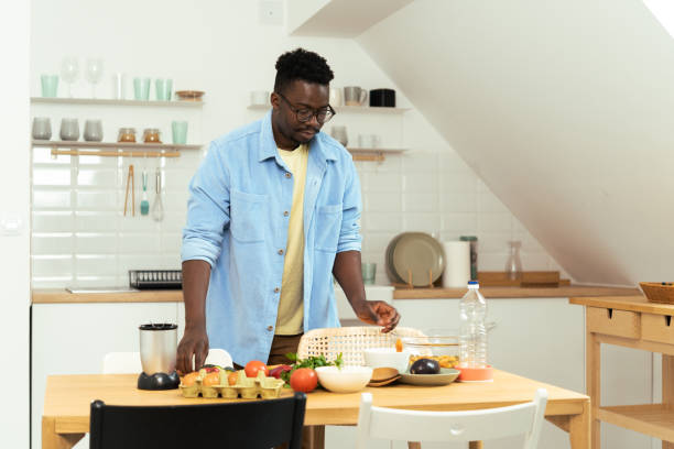 istock A young African-American man prepares a meal 1431802027
