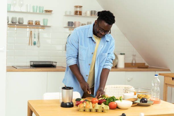 istock Man prepares a vegetarian meal 1431802035