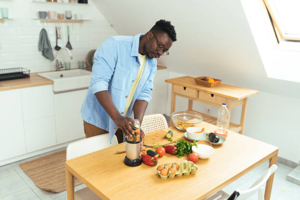 istock Man prepares a vegetarian meal 1431802052