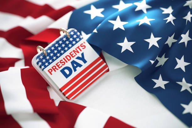 Presidents' Day Written Calendar Over Rippled American Flag Presidents' Day written calendar over rippled American flag. High angle view and horizontal composition. presidents day weekend stock pictures, royalty-free photos & images