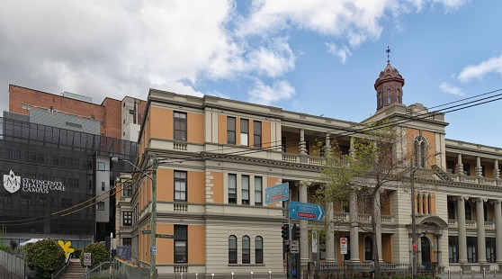 Darlinghurst, Sydney, New South Wales, Australia - St Vincents Hospital cnr Victoria and Burton Streets with healthcare campus and signs to emergency department.