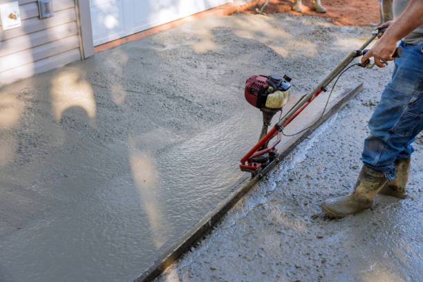 istock An alignment machine is used to align new concrete compacted layer of fresh concrete on new driveways that have been constructed. 1431838314