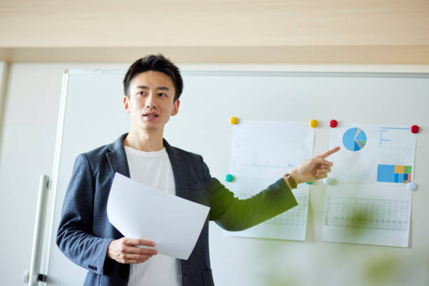 istock Young Japanese business giving a presentation 1431838523