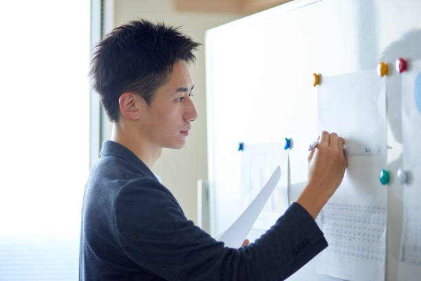 istock Young Japanese business giving a presentation 1431838524