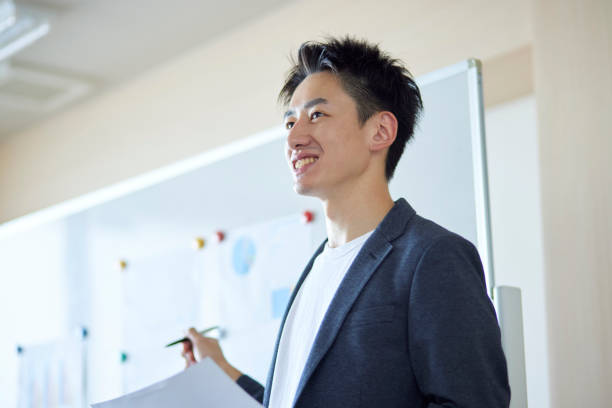 istock Young Japanese business giving a presentation 1431838526