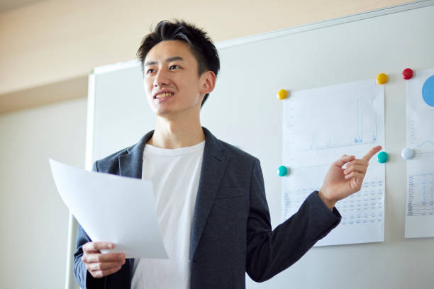 istock Young Japanese business giving a presentation 1431838536