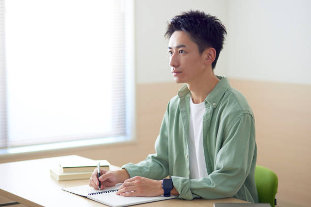 istock Young Japanese student studying in the classroom 1431838555