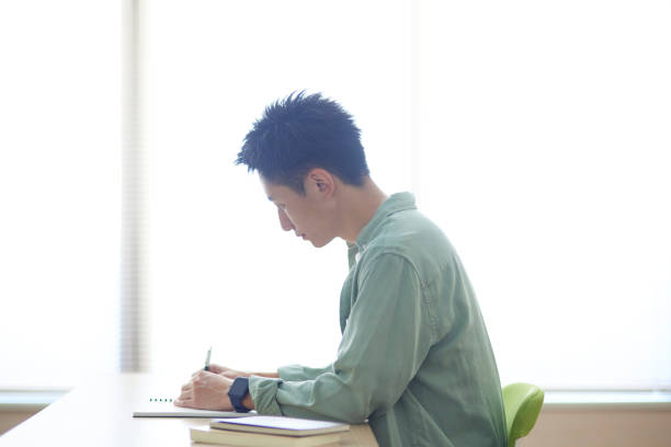 istock Young Japanese student studying in the classroom 1431838573